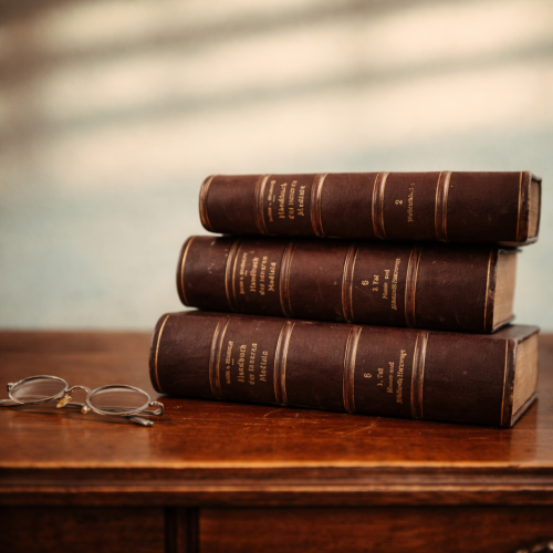 Antique medical books and vintage glasses