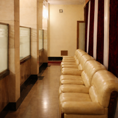 Elegant waiting area with cream sofas