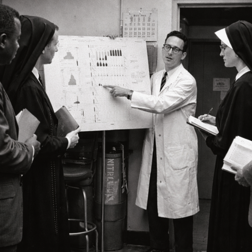 Scientist presenting data in lab